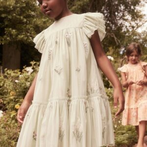Robe beige avec des fleurs